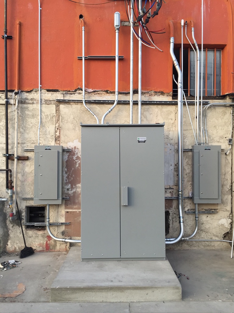 Exterior electrical panel and conduit installation