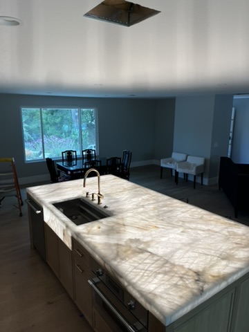 Kitchen island and ceiling lighting in a residential interior