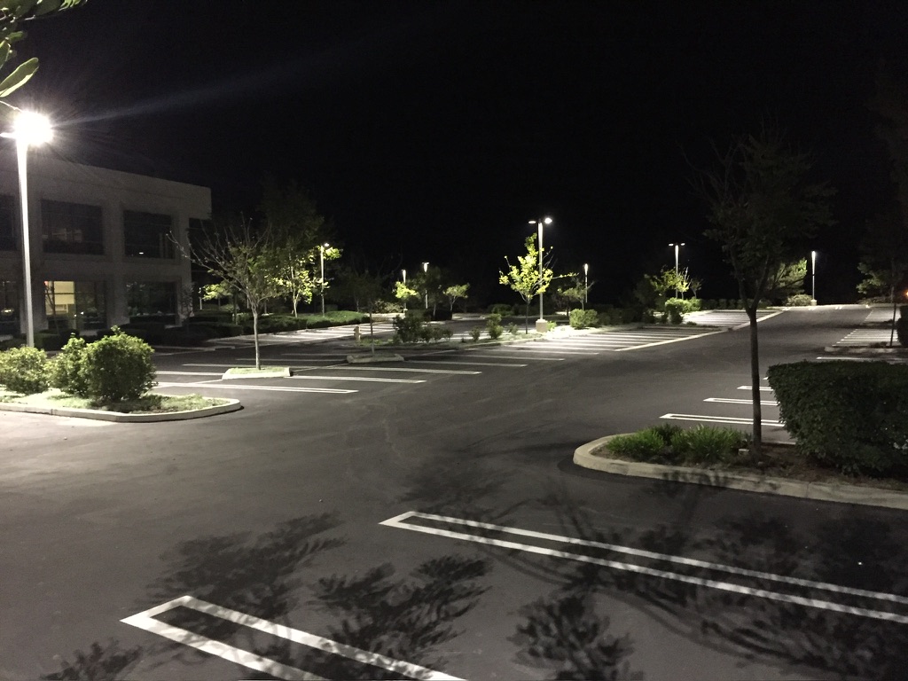 Commercial parking area illuminated at night